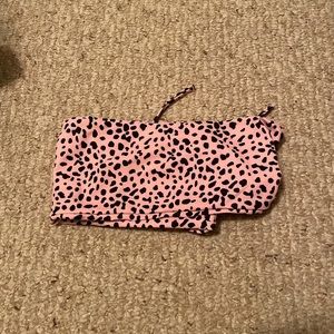 pink bathing suit top w/ a black cheetah print